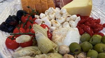 antipasto platter drizzled with homemade balsamic vinaigrette