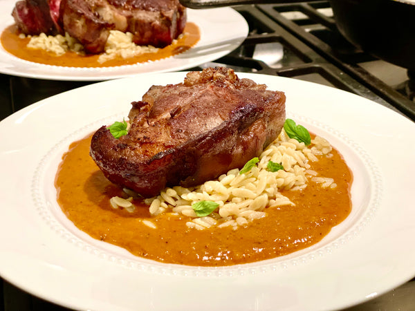 pan seared lamb chops over yellow curry sauce