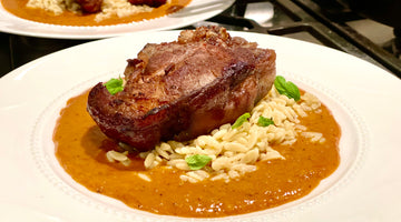 pan seared lamb chops over yellow curry sauce