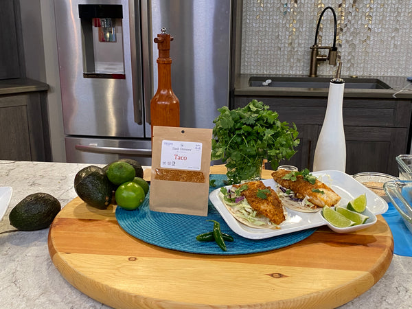 Easy Fish Taco Recipe with taco seasoning mix on kitchen counter spicekick
